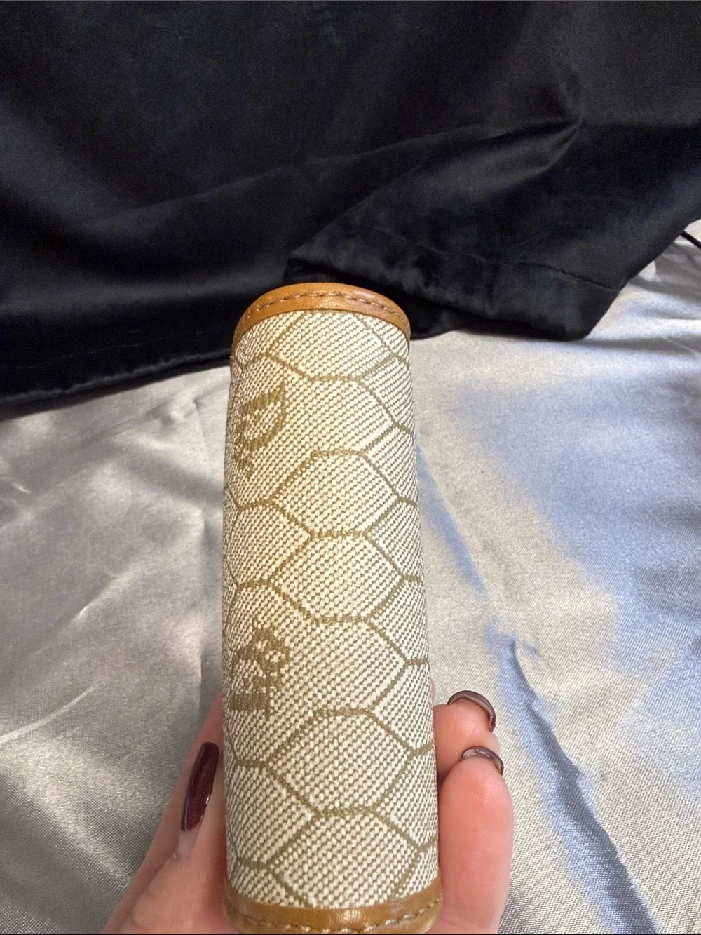 Dior honeycomb kiss lock coin purse.
